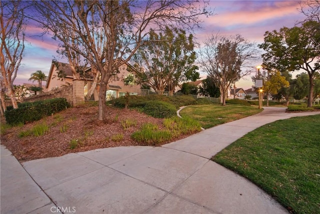 view of home's community featuring a lawn