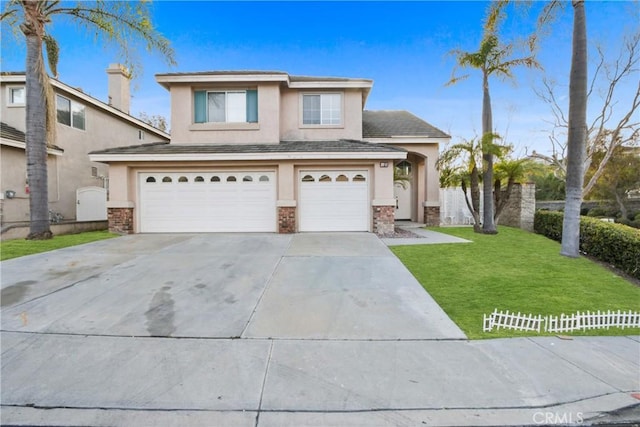 view of front of house featuring a garage, concrete driveway, fence, a front yard, and stucco siding