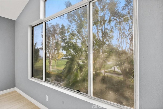 unfurnished sunroom with lofted ceiling