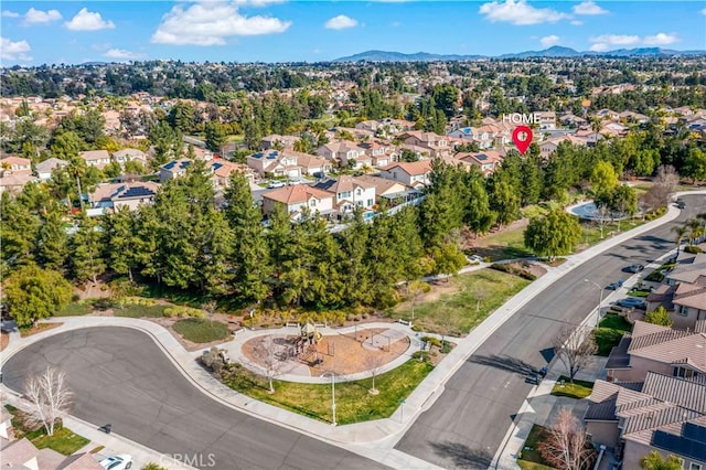 birds eye view of property with a mountain view and a residential view