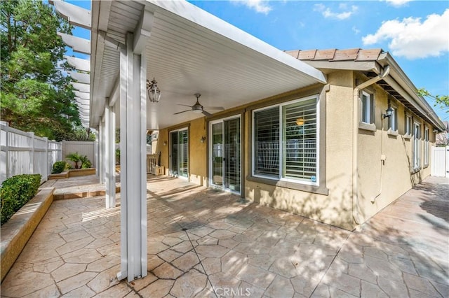 view of patio with a ceiling fan and a fenced backyard