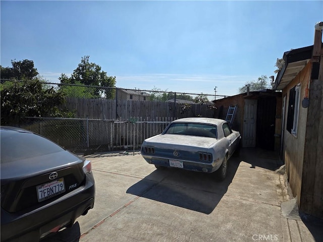 view of car parking with fence