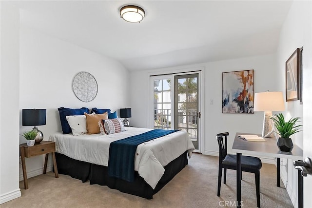 bedroom featuring lofted ceiling, access to exterior, baseboards, and light colored carpet