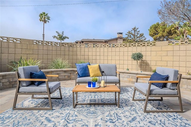 view of patio with a fenced backyard and an outdoor living space