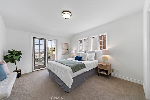 bedroom featuring access to exterior, carpet, and baseboards