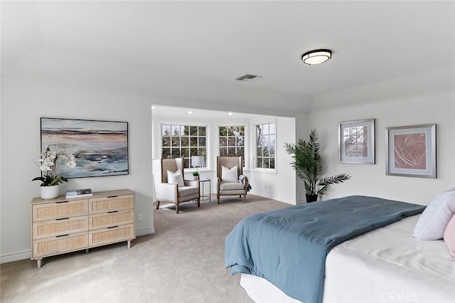 carpeted bedroom featuring baseboards and visible vents