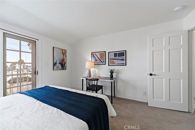 bedroom featuring carpet floors, lofted ceiling, and baseboards