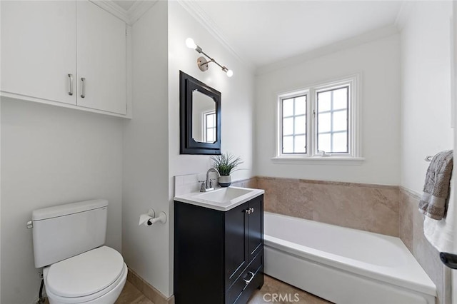 bathroom featuring toilet, a garden tub, crown molding, and vanity