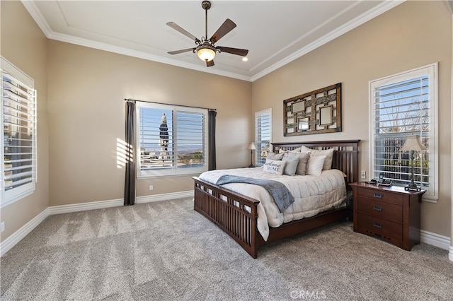 bedroom with light colored carpet, crown molding, baseboards, and ceiling fan