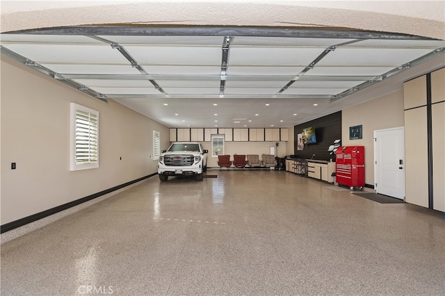 garage featuring baseboards