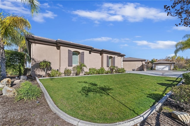 view of front of property with a front lawn and stucco siding