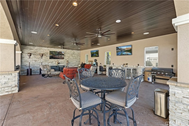 view of patio / terrace featuring a grill, a ceiling fan, and outdoor dining space