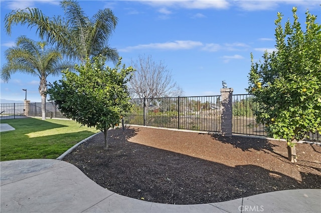 surrounding community with fence and a yard