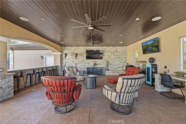 view of patio / terrace with outdoor wet bar and a ceiling fan