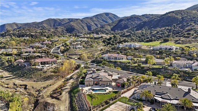 drone / aerial view with a residential view and a mountain view