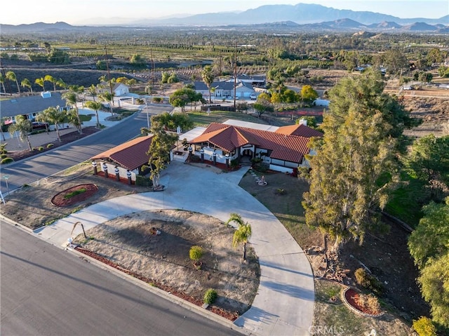 birds eye view of property with a mountain view