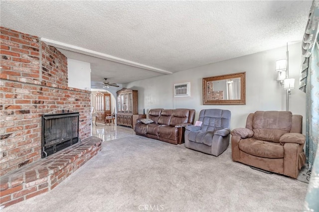 living area featuring a brick fireplace, carpet, a textured ceiling, and a wall mounted AC