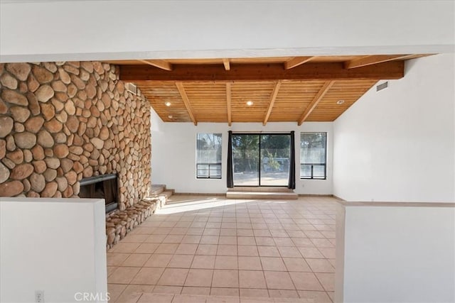 interior space featuring a fireplace, light tile patterned floors, visible vents, lofted ceiling with beams, and wooden ceiling