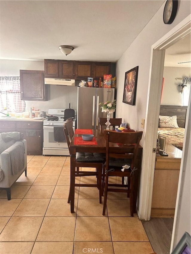 dining area with light tile patterned floors