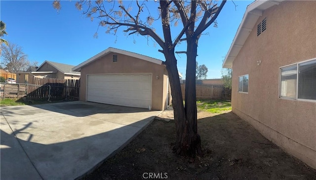 garage featuring fence