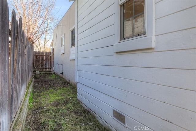 view of home's exterior featuring fence