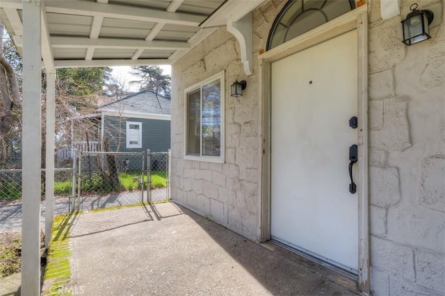 property entrance with a gate and fence