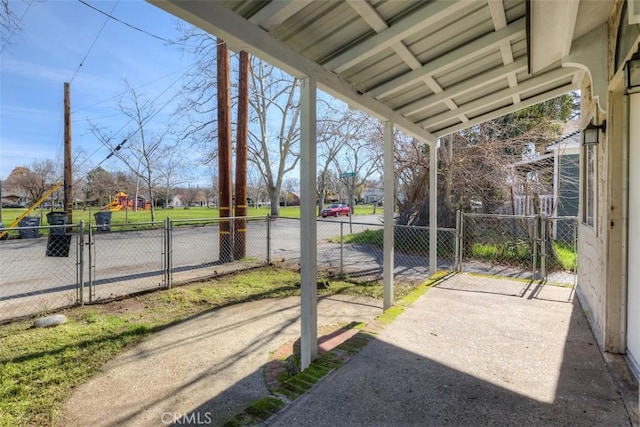 view of patio featuring fence and a gate