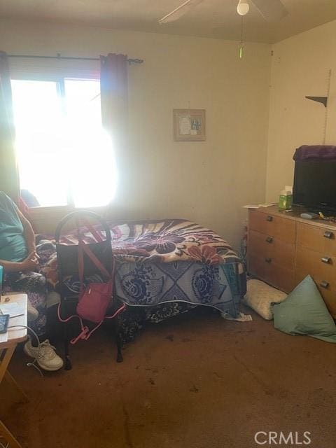 carpeted bedroom with a ceiling fan