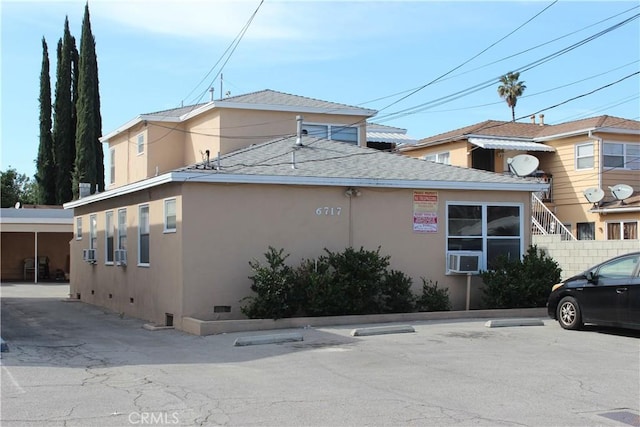 view of building exterior featuring cooling unit