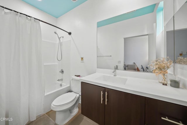 bathroom with toilet, shower / bath combo, and vanity