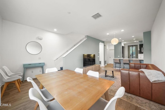 dining area featuring light wood-type flooring, visible vents, and recessed lighting