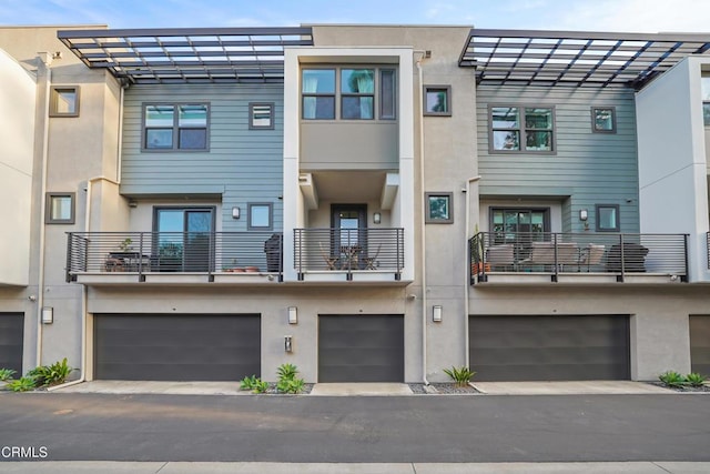 exterior space featuring a garage and stucco siding