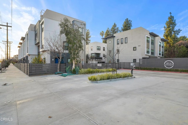 exterior space with curbs and a residential view