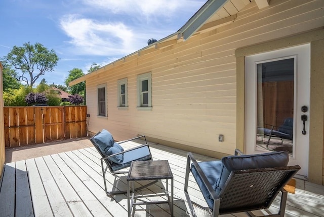 wooden deck featuring fence