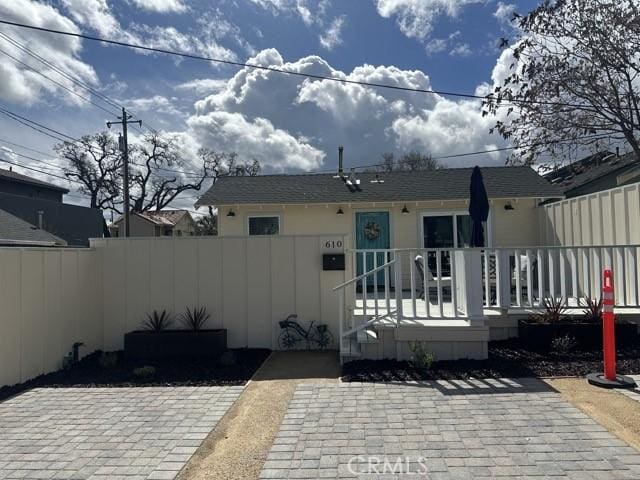 back of house featuring fence private yard and a patio area