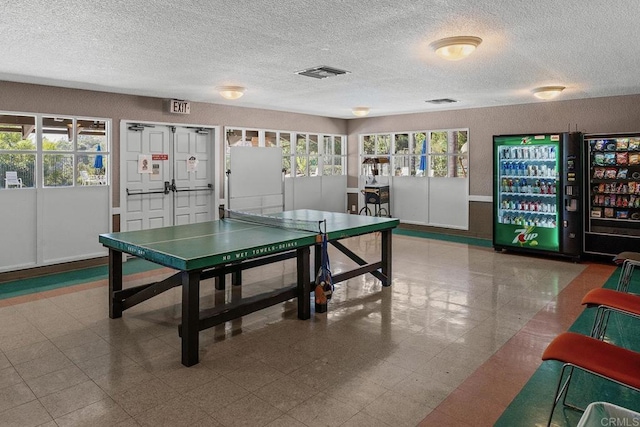 game room with a textured ceiling and visible vents