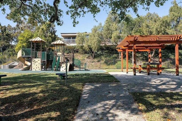 community playground with fence and a lawn