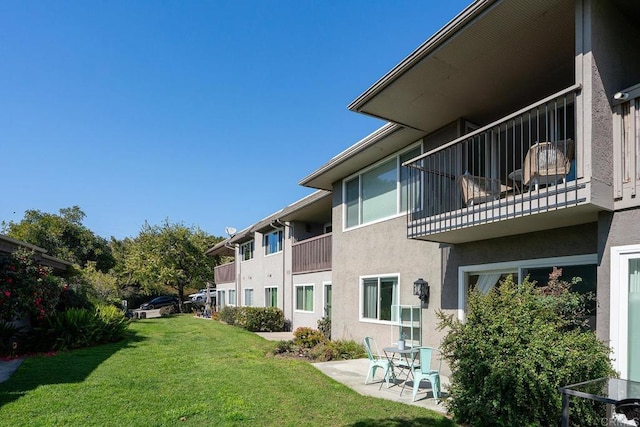 exterior space featuring a yard and a patio