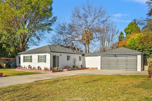 ranch-style home with concrete driveway, a front yard, and stucco siding