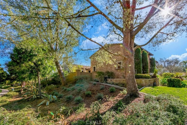 view of home's exterior with fence