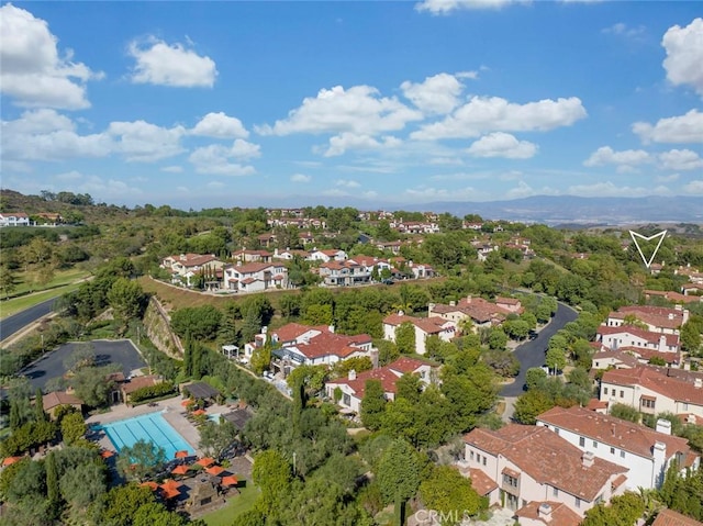 birds eye view of property with a residential view