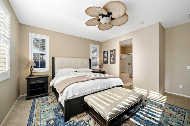 bedroom with ceiling fan and baseboards