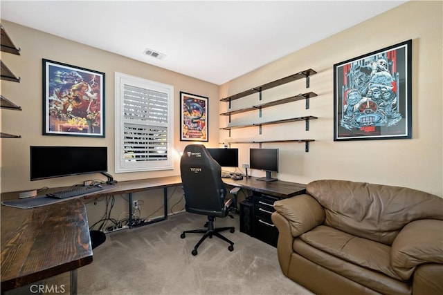 office area featuring visible vents and light colored carpet