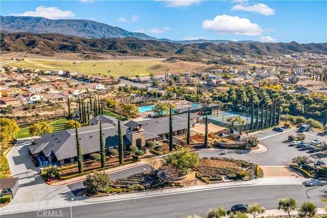 birds eye view of property with a residential view and a mountain view