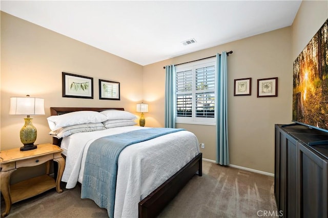 bedroom with baseboards, visible vents, and carpet flooring