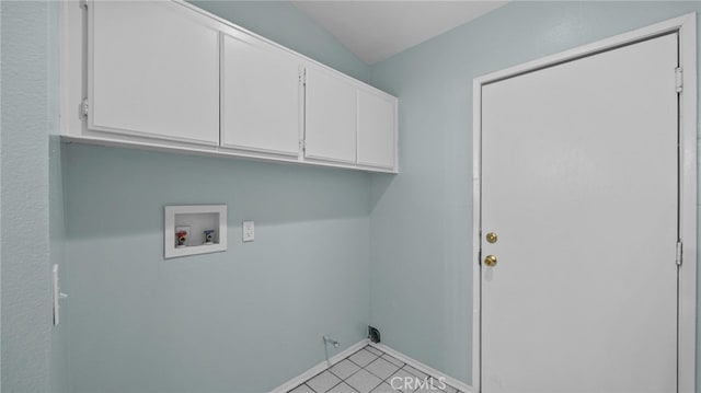 laundry room with light tile patterned floors, hookup for a washing machine, cabinet space, gas dryer hookup, and baseboards