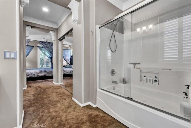 ensuite bathroom with ornamental molding, baseboards, shower / bath combination with glass door, and ensuite bath