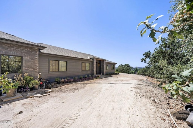 view of front of house featuring brick siding