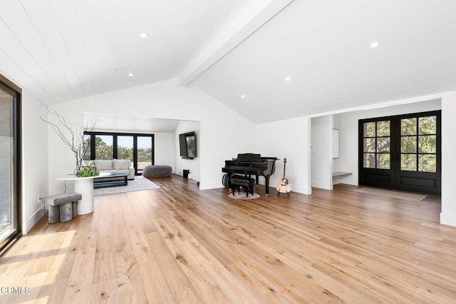 interior space featuring french doors, vaulted ceiling with beams, light wood-style flooring, and baseboards