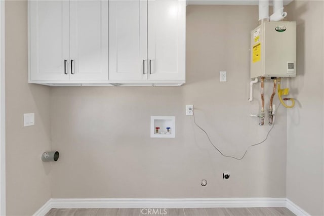 laundry room with cabinet space, baseboards, water heater, washer hookup, and electric dryer hookup